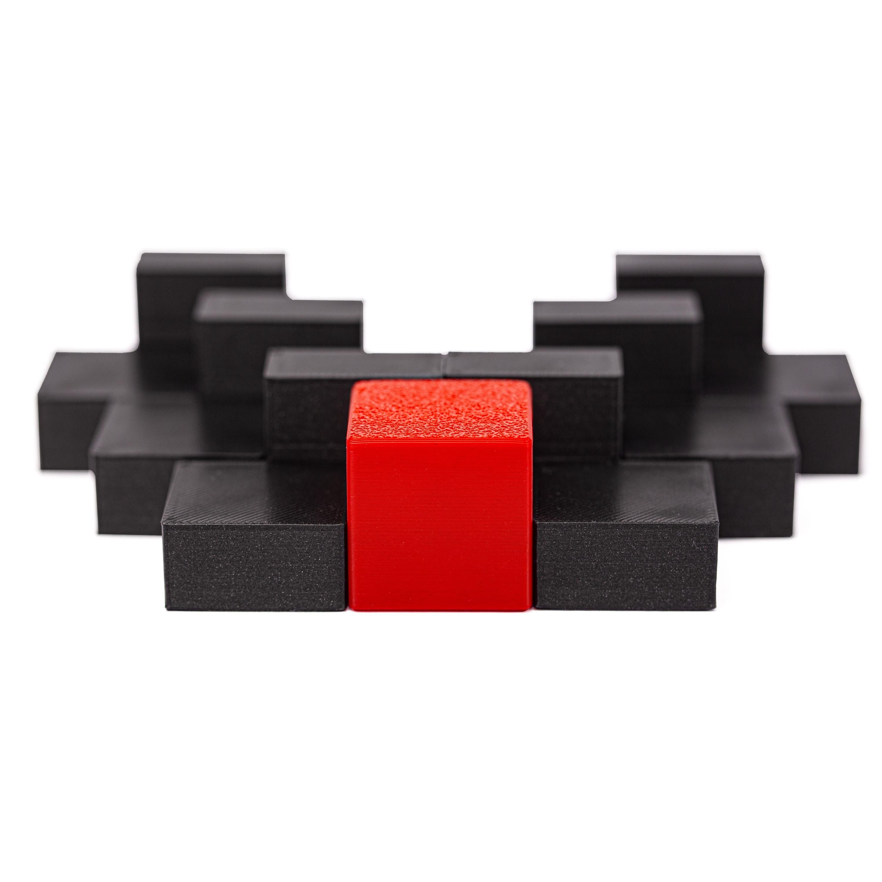 Surround the red cube with 6 black pieces. Surround puzzle.