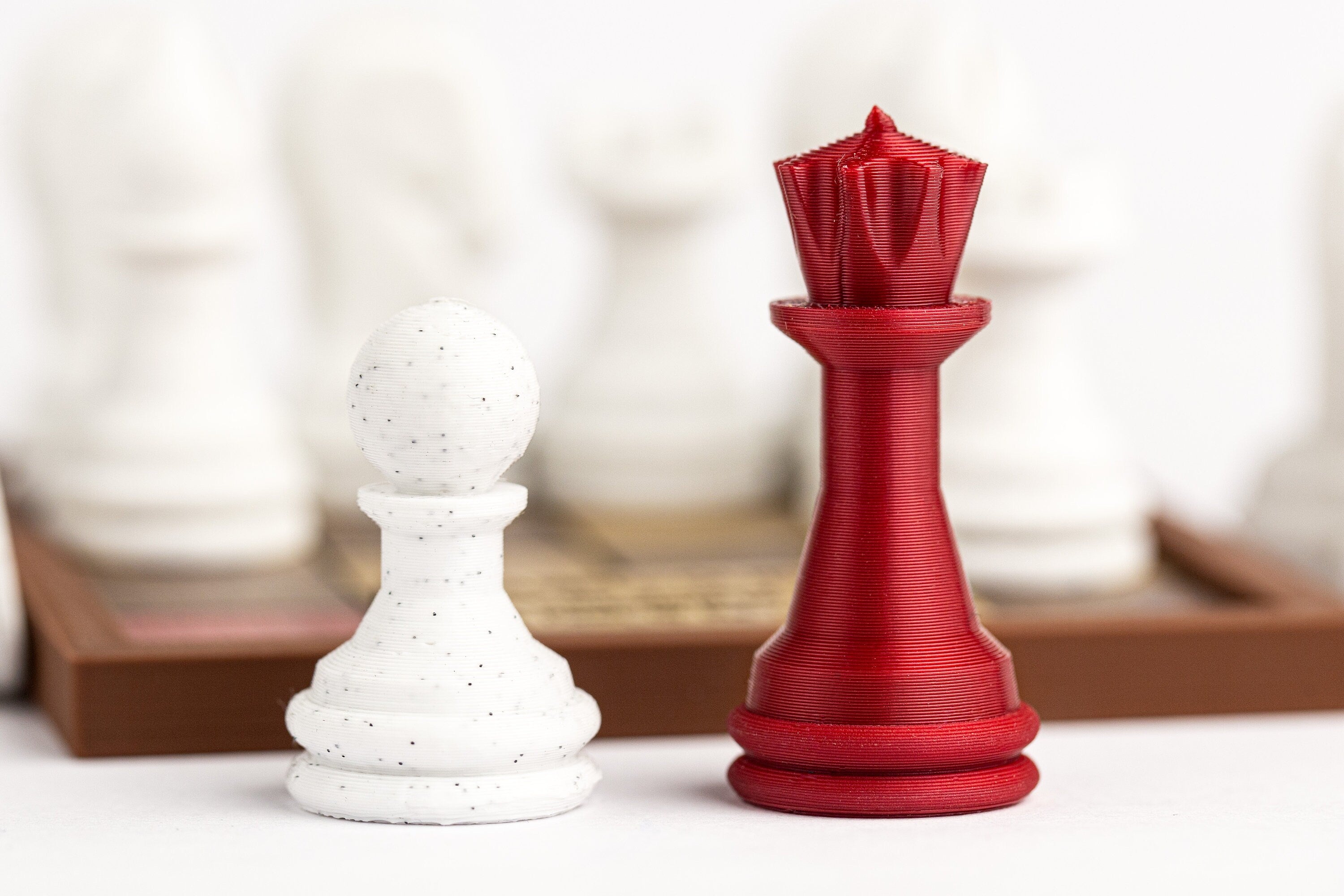 Pawn = Queen puzzle. Get the pawn to the red square.