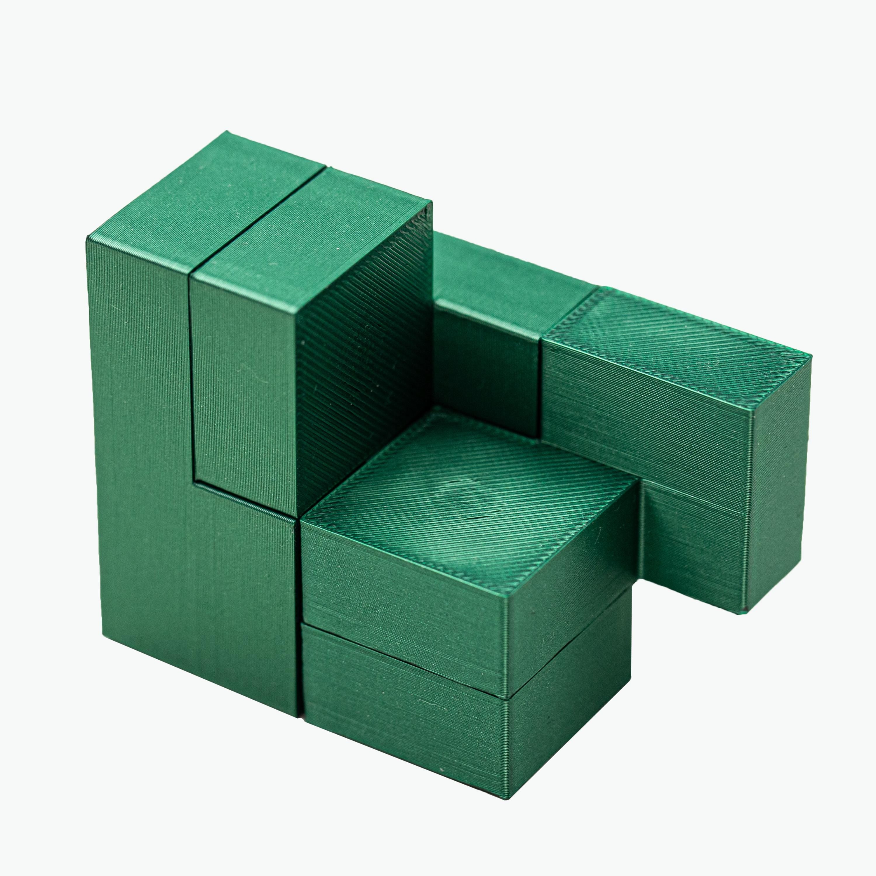 Four Cubes puzzle. Make 4 cubes using 4 parts.