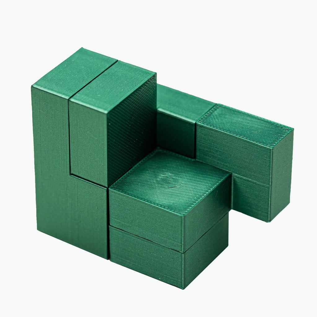 Four Cubes puzzle. Make 4 cubes using 4 parts.