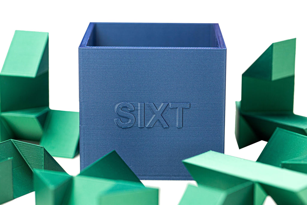 SIXT puzzle. Put all 6 parts inside the box.