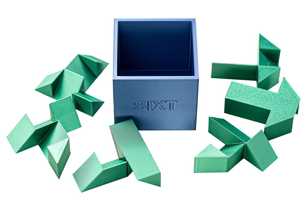 SIXT puzzle. Put all 6 parts inside the box.