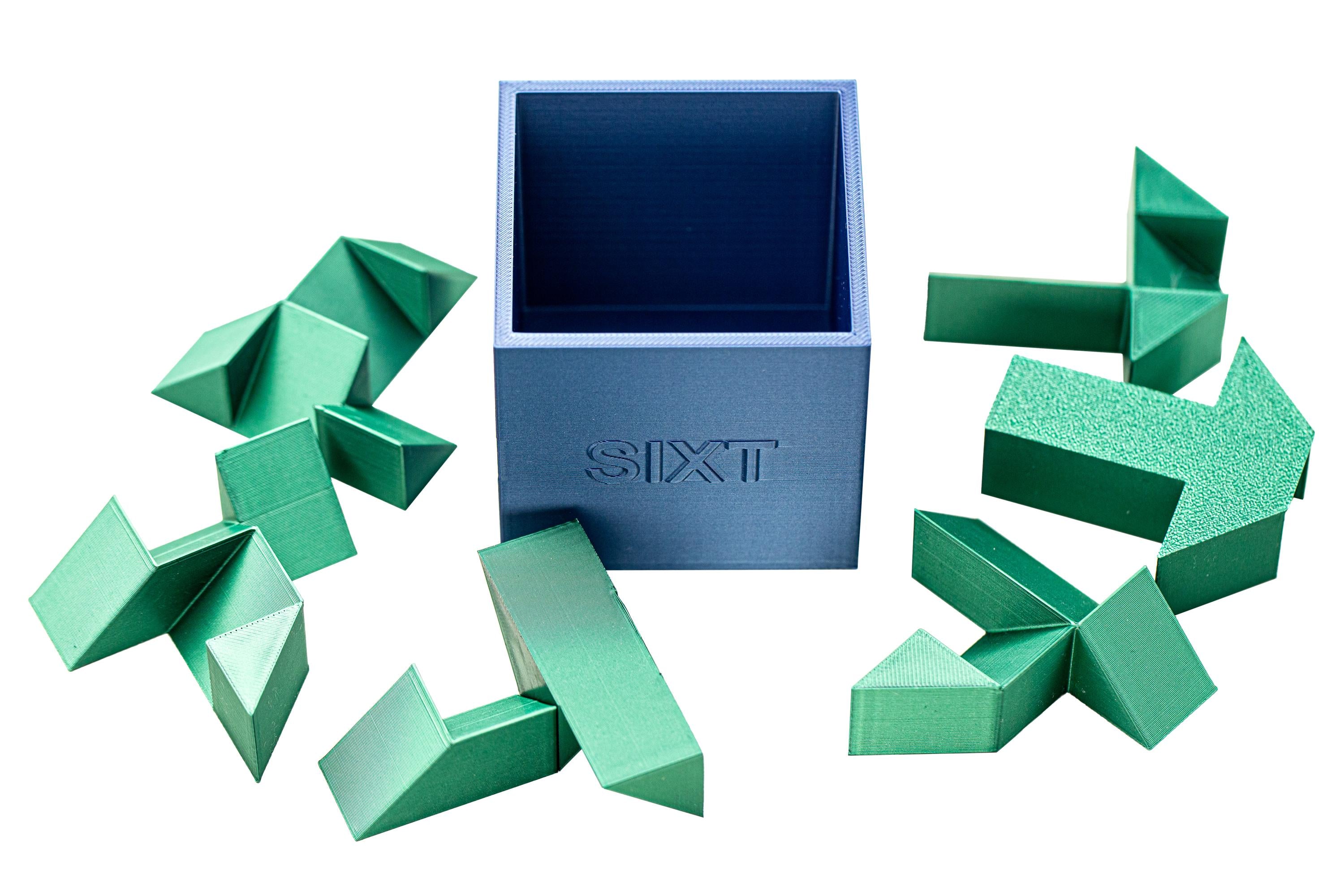 SIXT puzzle. Put all 6 parts inside the box.